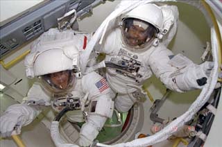 Harris and Foale are ready to egress airlock for an EVA. 